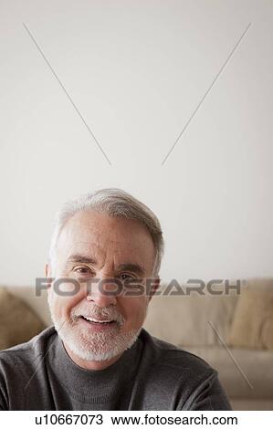 Stock Image - Portrait of smiling senior man. Fotosearch