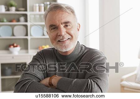 Stock Photograph - Portrait of smiling senior man. Fotosearch