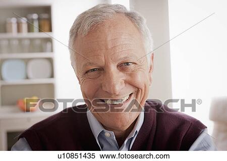 Stock Photography - Portrait of smiling senior man. Fotosearch