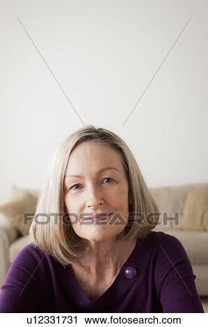 Stock Image - Portrait of smiling senior woman. Fotosearch