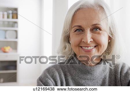 Portrait of smiling senior woman View Large Photo Image Stock Photo - Portrait of smiling senior woman. Fotosearch