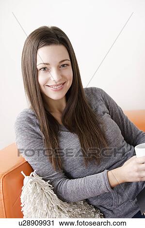 Portrait of smiling young woman View Large Photo Image Stock Image - Portrait of smiling young woman. Fotosearch