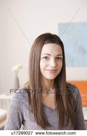 Portrait of smiling young woman View Large Photo Image Stock Photo - Portrait of smiling young woman. Fotosearch