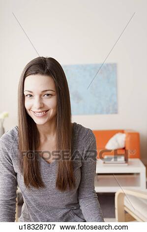 Stock Photo - Portrait of smiling young woman. Fotosearch