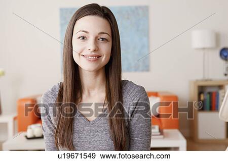 Portrait of smiling young woman View Large Photo Image Stock Photo - Portrait of smiling young woman. Fotosearch