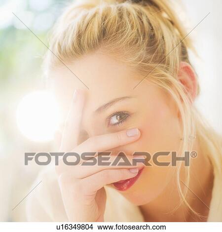 Portrait of smiling young woman with blonde hair View Large Photo Image Picture - Portrait of smiling young woman with blonde hair. Fotosearch