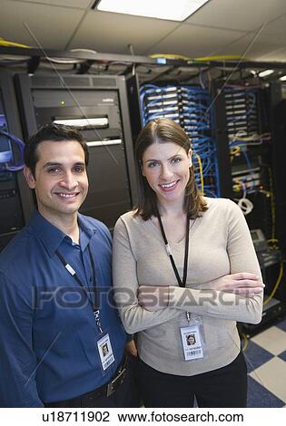 Portrait of technicians in network server room View Large Photo Image Stock Image - Portrait of technicians in network server room. Fotosearch