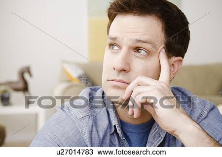 Portrait of thoughtful mid adult man View Large Photo Image Stock Image - Portrait of thoughtful mid adult man. Fotosearch
