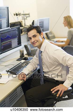 Portrait of trader at trading desk View Large Photo Image Stock Image - Portrait of trader at trading desk. Fotosearch