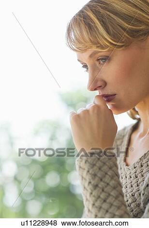 Stock Photo - Portrait of woman contemplating. Fotosearch