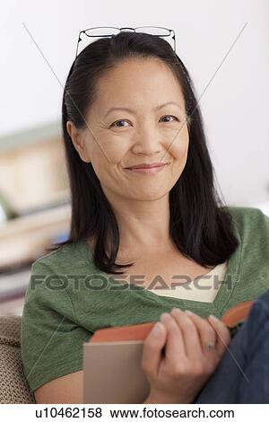 Portrait of woman reading book View Large Photo Image Stock Photo - Portrait of woman reading book. Fotosearch