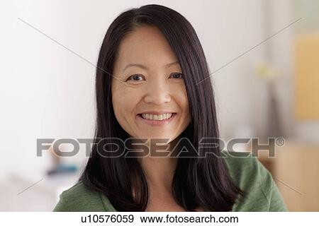 Stock Photo - Portrait of woman smiling. Fotosearch
