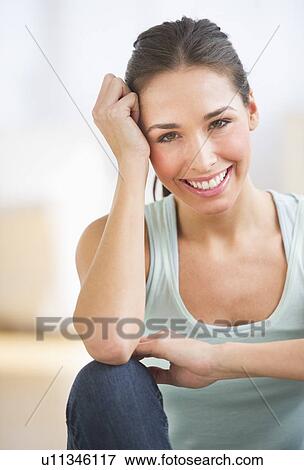 Stock Photo - Portrait of woman smiling. Fotosearch