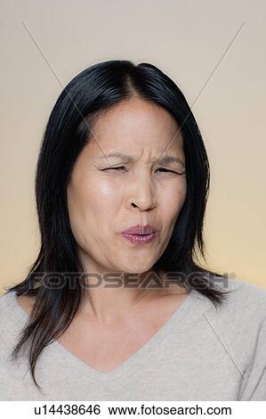 Stock Photograph - Portrait of woman with disgusted expression. Fotosearch