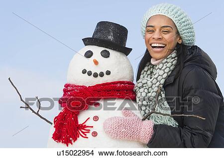 Portrait of woman with snowman View Large Photo Image Picture - Portrait of woman with snowman. Fotosearch