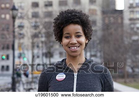 Portrait of woman with vote pin View Large Photo Image Stock Image - Portrait of woman with vote pin. Fotosearch