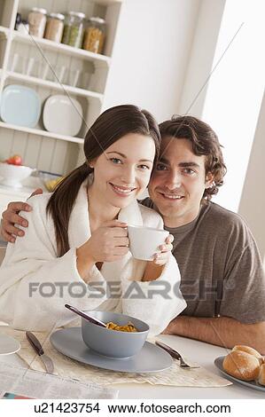 Portrait of young couple at breakfast View Large Photo Image Picture - Portrait of young couple at breakfast. Fotosearch