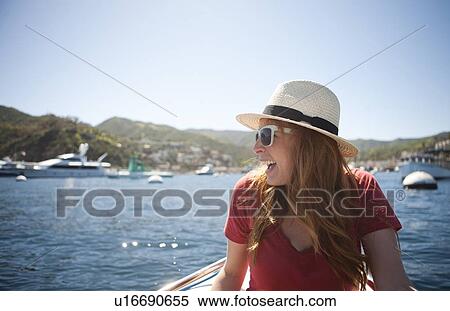 Portrait of young woman in sunglasses and straw hat View Large Photo Image Stock Photography - Portrait of young woman in sunglasses and straw hat. Fotosearch