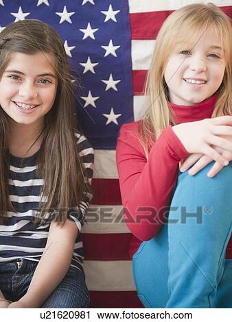 Portrait up of two girls in front of american flag View Large Photo Image Stock Image - Portrait up of two girls in front of american flag. Fotosearch