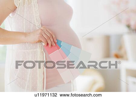 Pregnant woman with paint samples View Large Photo Image Stock Image - Pregnant woman with paint samples. Fotosearch