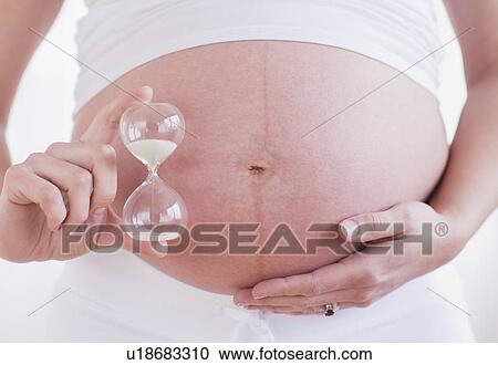Pregnant woman with ultrasonography scan View Large Photo Image Stock Image - Pregnant woman with ultrasonography scan. Fotosearch