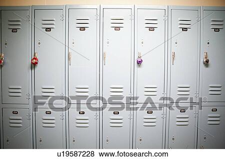 Stock Photo - Row of lockers with different padlocks. Fotosearch