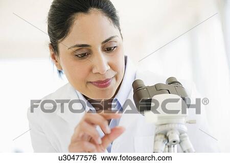 Scientist examining medical sample View Large Photo Image Stock Photograph - Scientist examining medical sample. Fotosearch