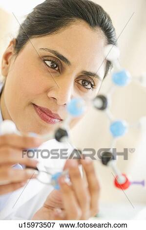 Scientist holding molecular model View Large Photo Image Stock Photo - Scientist holding molecular model. Fotosearch