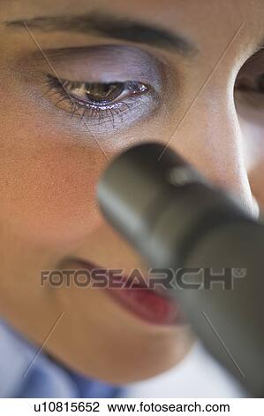 Scientist looking through microscope View Large Photo Image Stock Image - Scientist looking through microscope. Fotosearch
