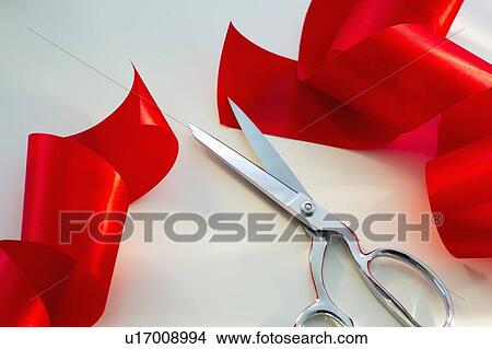 Scissors and red ribbon, studio shot View Large Photo Image Picture - Scissors and red ribbon, studio shot. Fotosearch