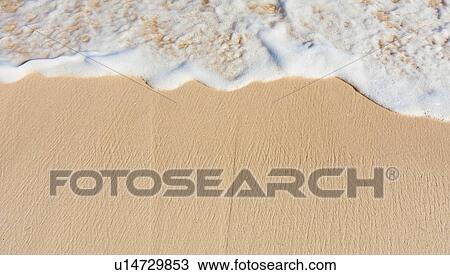 Sea waves on beach sand View Large Photo Image Stock Image - Sea waves on beach sand. Fotosearch