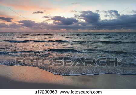 Stock Image - Seascape at sunset. Fotosearch