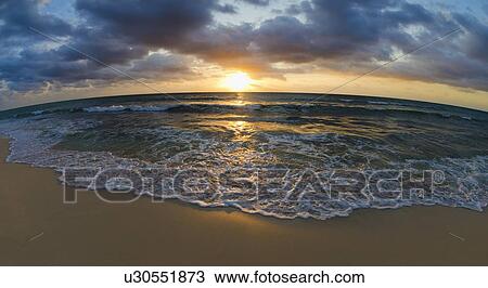 Stock Image - Seascape at sunset. Fotosearch