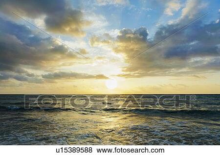 Stock Photo - Seascape at sunset. Fotosearch