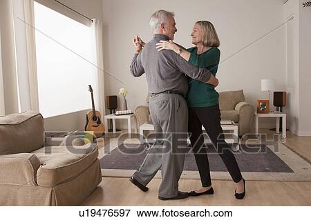senior couple dancing at home View Large Photo Image Stock Photo - senior couple dancing at home. Fotosearch