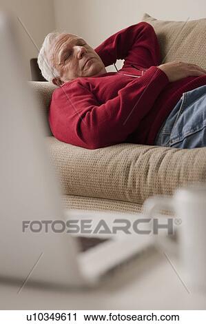 Senior man sleeping on sofa View Large Photo Image Stock Image - Senior man sleeping on sofa. Fotosearch