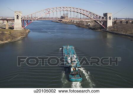 Stock Image - Ship under bridge. Fotosearch