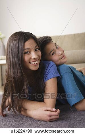Stock Photo - Sister and brother smiling. Fotosearch