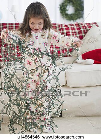 Small girl (4-5 years) preparing Christmas lights View Large Photo Image Stock Photograph - Small girl (4-5 years) preparing Christmas lights. Fotosearch