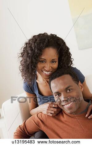 Stock Image - Smiling mid adult couple together. Fotosearch