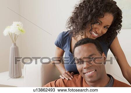Stock Image - Smiling mid adult couple together. Fotosearch