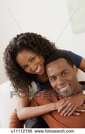 Stock Photograph - Smiling mid adult couple together. Fotosearch