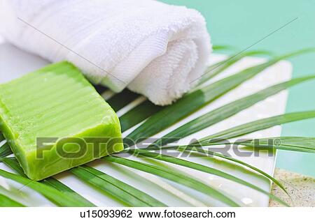 Stock Image - Soap, towel and palm leaf. Fotosearch