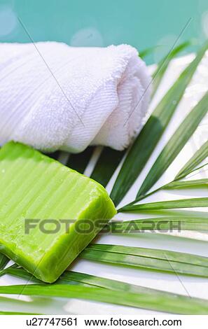 Stock Image - Soap, towel and palm leaf. Fotosearch