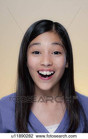 Stock Image - Studio Portrait of girl (12-13). Fotosearch