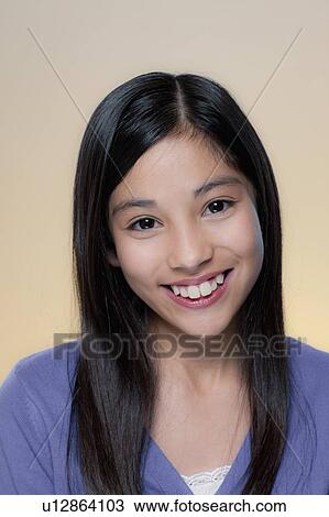 Stock Image - Studio Portrait of girl (12-13). Fotosearch