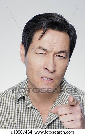Studio portrait of mature man pointing finger View Large Photo Image Picture - Studio portrait of mature man pointing finger. Fotosearch