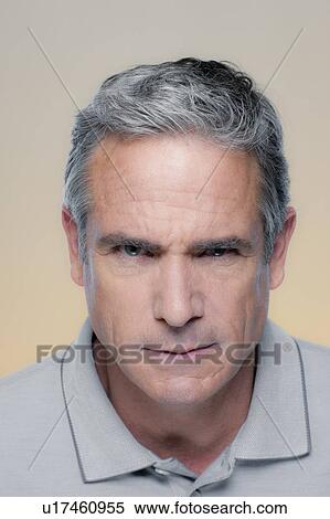 Studio Portrait of mature man staring at camera View Large Photo Image Stock Photography - Studio Portrait of mature man staring at camera. Fotosearch