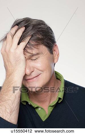 Studio portrait of mature man with head in hands View Large Photo Image Stock Image - Studio portrait of mature man with head in hands. Fotosearch