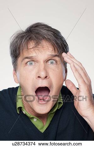 Picture - Studio portrait of mature man with facial expression. Fotosearch